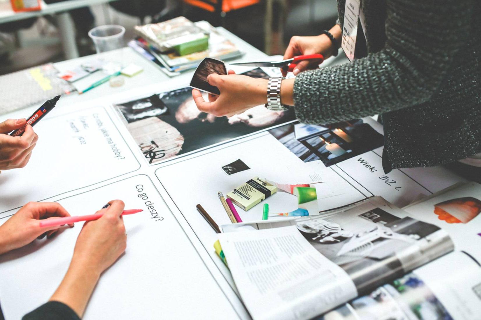 hands hovering over business materials